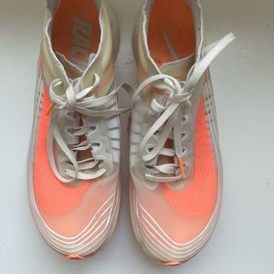 Nike sneakers clear with orange swoosh